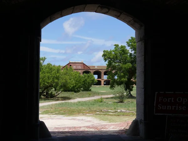 Fort Jefferson framed by a brick arch at the Dry Tortugas National Park, Florida.