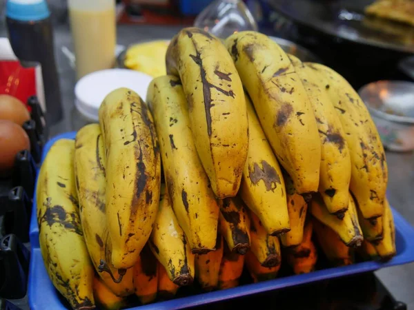Ripe bananas for sale at a street food market stall