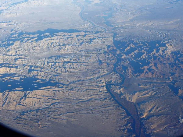 Airplane window view of the terrains of state of Arizona