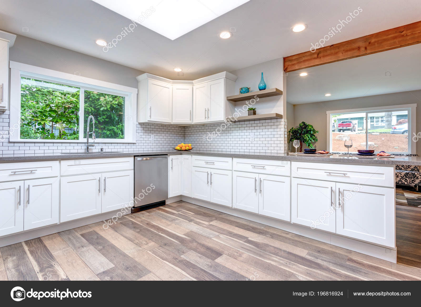Open Concept Kitchen White Cabinets Grey Quartz Countertops Tile ...