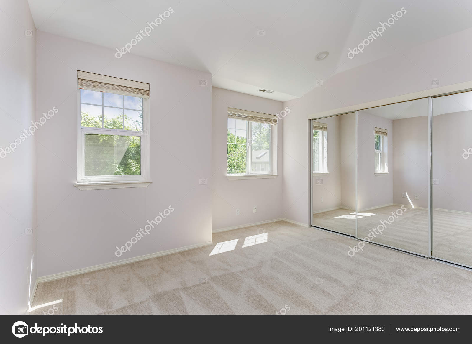 Empty Sun Filled Bedroom Carpet Floor Mirrored Closet Doors
