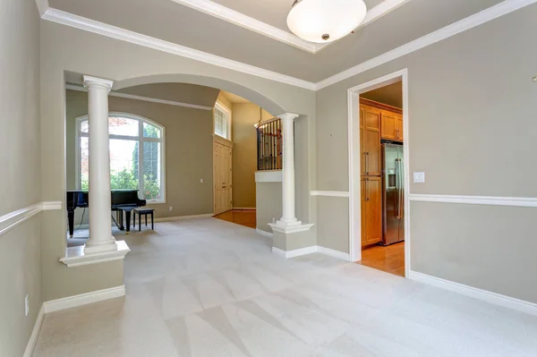 Elegant arched entryway accented with white columns.