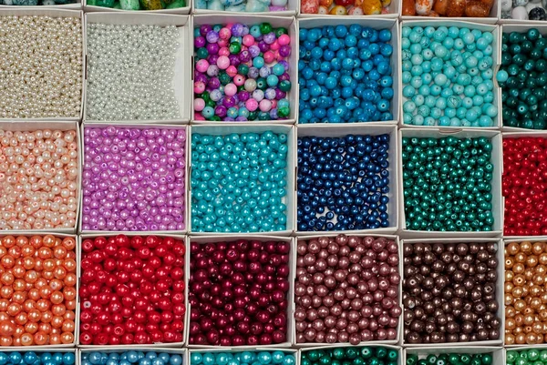 Multicolored beads in a in bijouterie shop for handmade accessories