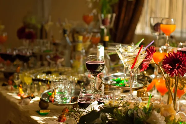 Glass glasses with colored drinks on the table. alcoholic drinks at the buffet