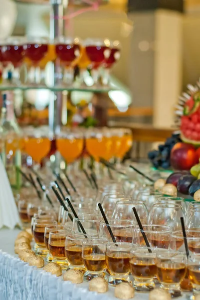 Glass glasses with colored drinks on the table. alcoholic drinks at the buffet