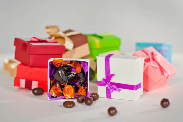 Handmade paper boxes. Gift boxes for candies. Small boxes on the table.