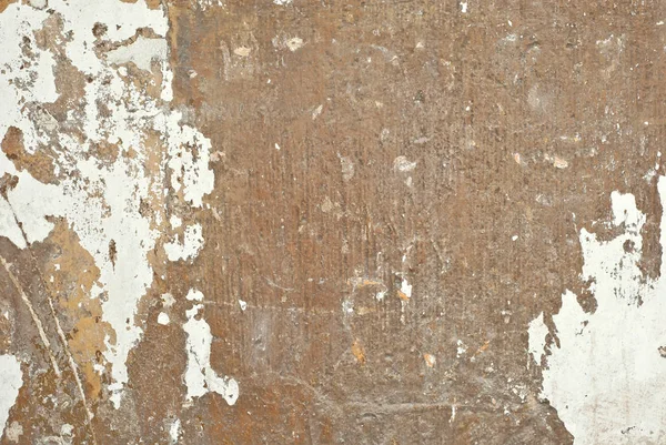 The texture of an old concrete wall with drawings and patterns.