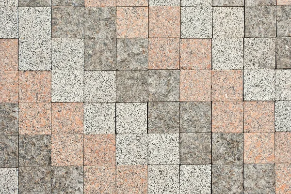 石畳のテクスチャー 歩道タイルは均等に折り畳まれがあります 花崗岩と大理石の舗装の様々な色 — ストック写真