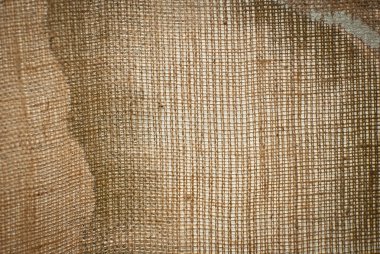 Eski kirli çanta dokusu yakın çekim. Yırtık ve kirli bez. Örgü kumaş bezi..