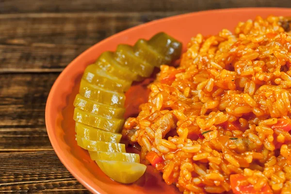 Pilaf Meat Cucumbers Greens Carrots Orange Plate Rice Wooden Brown — Stock Photo, Image