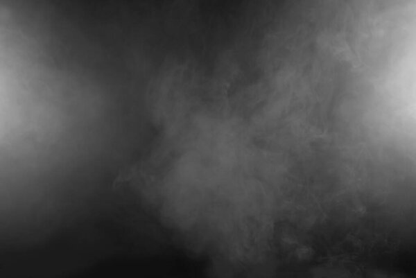 White smoke on a black background. The texture of scattered smoke. Blank for design. Layout for collages.