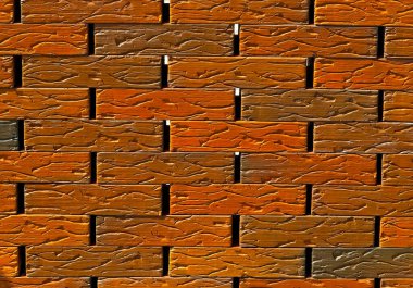 Tuğla duvar dokusu. Yeni tuğla işi. Sergilerde duvar veya çit örnekleri sunuluyor. Turuncu tuğla yakın çekim.