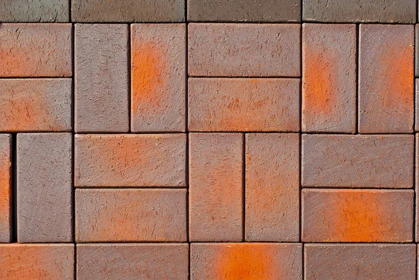 石畳の質感 歩道のタイルは均等に折り畳まれています 茶色とオレンジの石畳が閉じます — ストック写真