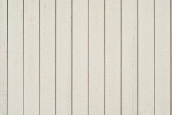 Wall texture with striped paneling. White lining close up.