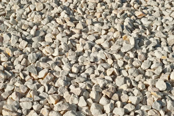 Drainage systems from small pebbles. Garden drainage for plants and trees. White stones for roads and flower beds.