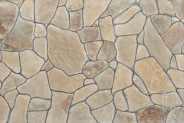 Tuğla duvar ve beton bloklar. Sıraya dizilmiş taş levha örnekleri.