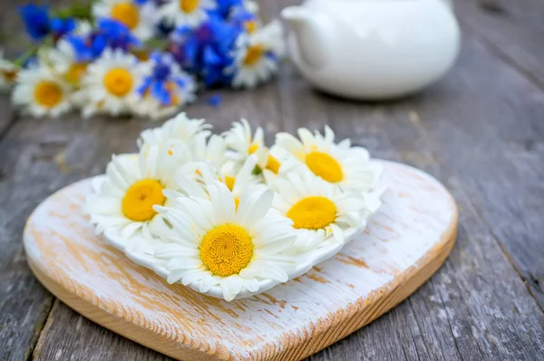 Tea prepared from chamomile flowers for tea. Tea from natural herbs. Copy space.