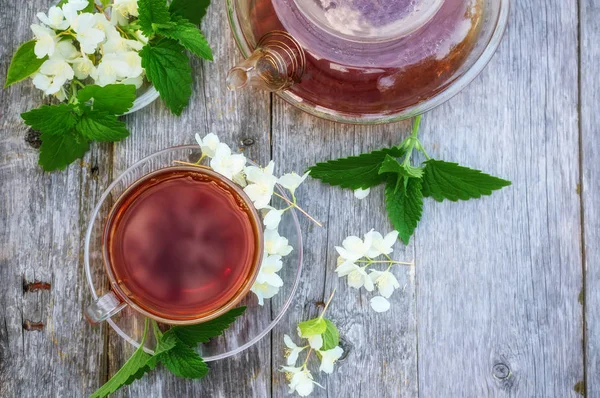 Hot tea with Jasmine in a glass transparent Cup. Close up.