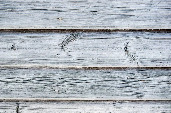 The original wooden background of thin old boards. Texture. Brown textured boards, located .horizontal