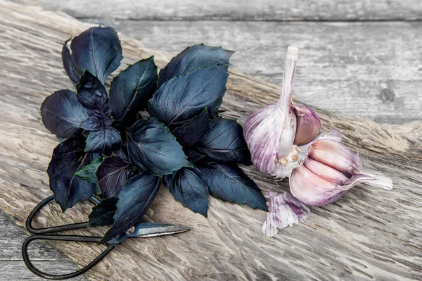 bunch of purple basil on a wooden table