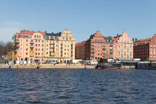 Stockholm, Sweden - April 21 2019: the view of colorful buildings on Kungsholmen waterfront in a sunny day on April 21 2019 in Stockholm Sweden.