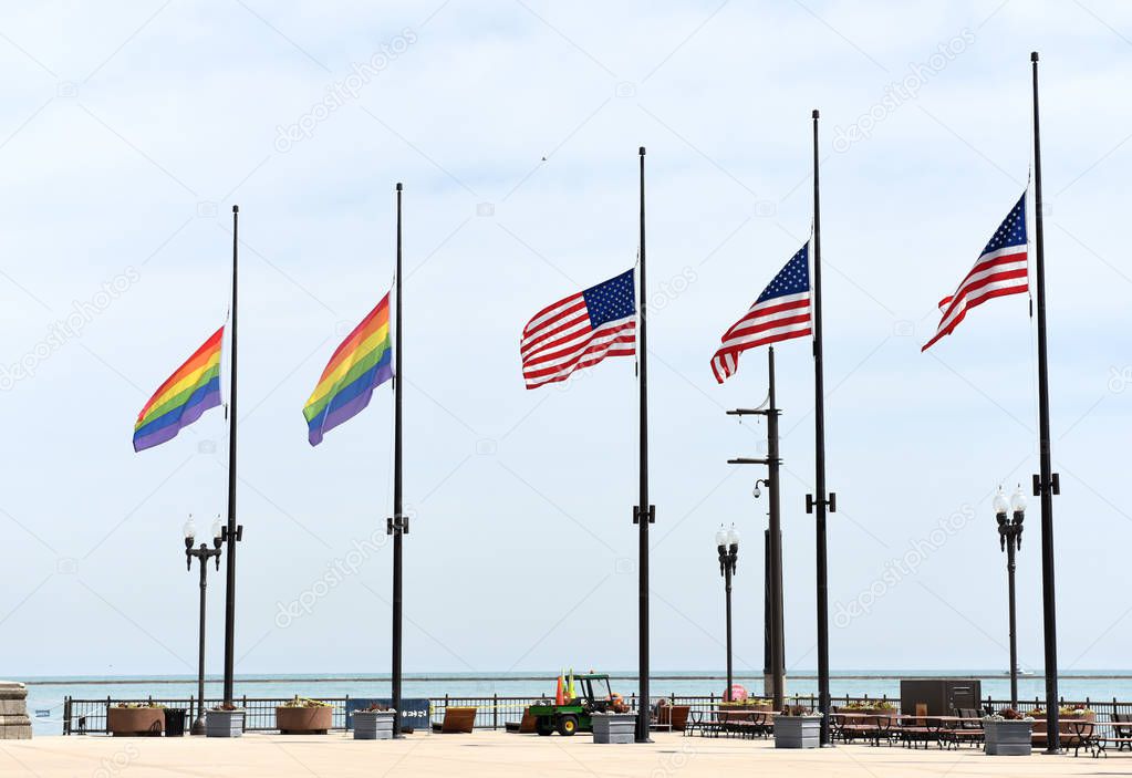 A rainbow flags and flags of US in Chicago, USA