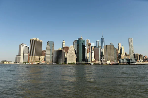 View on financial district in lower Manhattan from Brooklyn Bridge Park, New York.