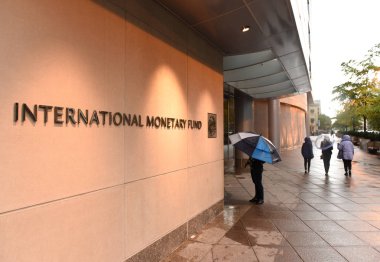 Washington, DC - June 04, 2018: People near the International Monetary Fund, IMF Headquarters 2 Building (HQ2) in DC. clipart