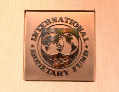 Washington, DC - June 04, 2018: Emblem of International Monetary Fund on the Headquarters 2 Building (HQ2) in DC. clipart