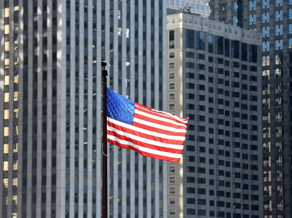 American flag waving in downtown of Chicago, USA