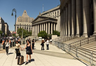 New York, USA - May 24, 2018: People near the Thurgood Marshall Courthouse and New York County Supreme Court . clipart