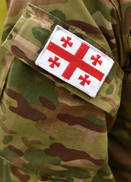 Georgian patch flag on soldiers arm. Georgia troops