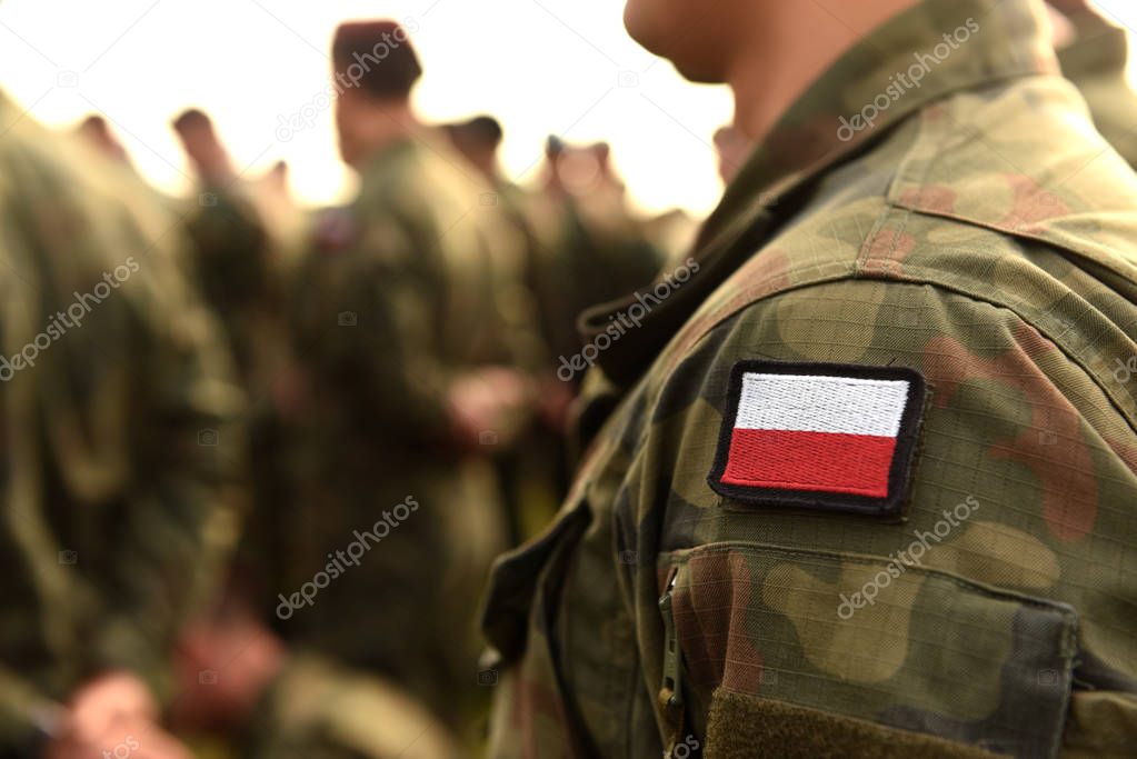 Polish patch flag on soldiers arm. Poland military uniform. Poland troops