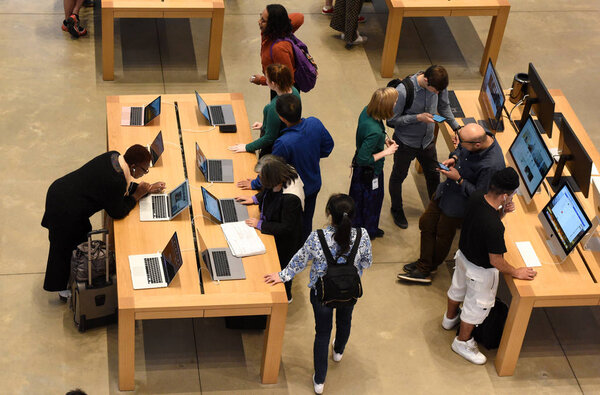 New York, USA - June 08, 2018: People in store Apple Fifth Avenue in New York, NY.