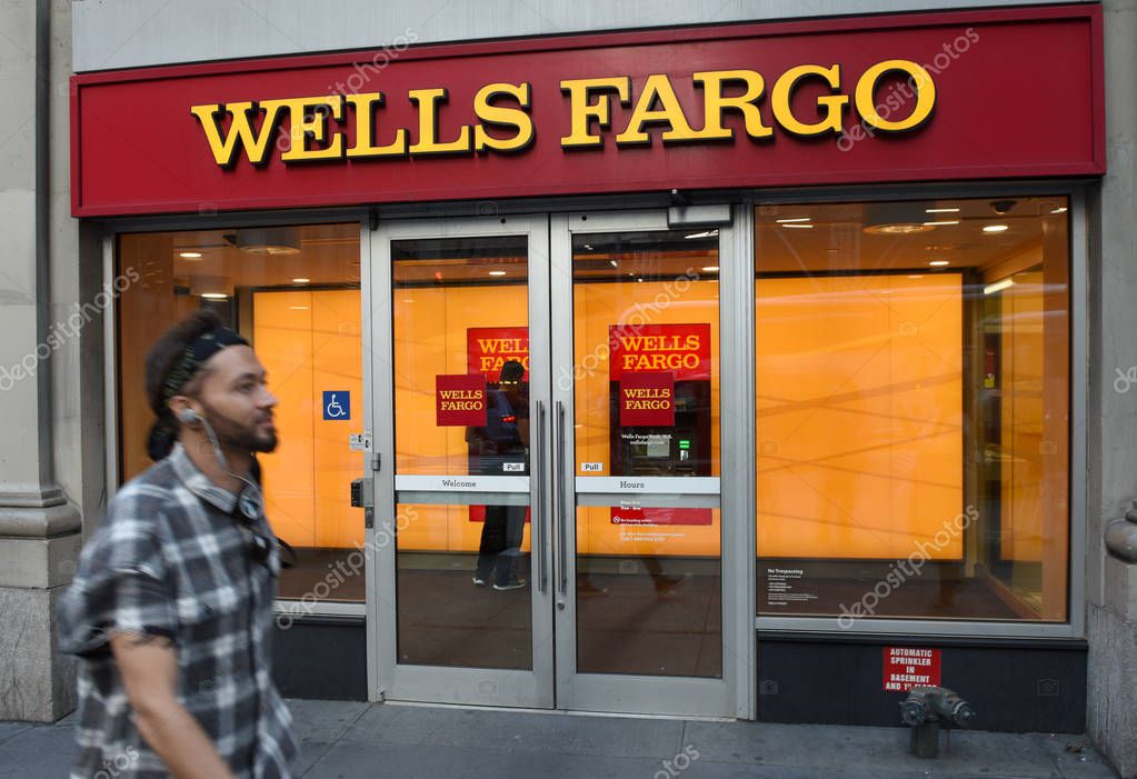 New York, USA - May 30, 2018: Man near the Wells Fargo Bank in New York.