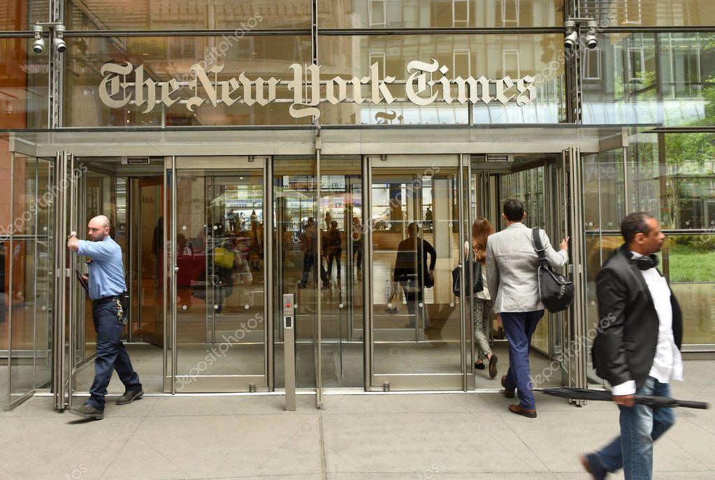New York, USA - May 31, 2018: People near the entrance in New York Times building in New York.