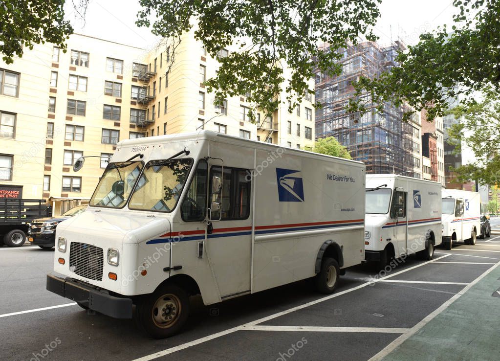 New York, USA - June 9, 2018: The cars of United States Postal Service (USPS) on the street of New York.
