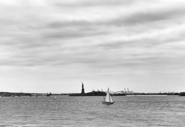 Statue of Liberty and yacht, New York City, NY, USA