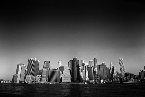 View on financial district in lower Manhattan from Brooklyn Bridge Park, New York.