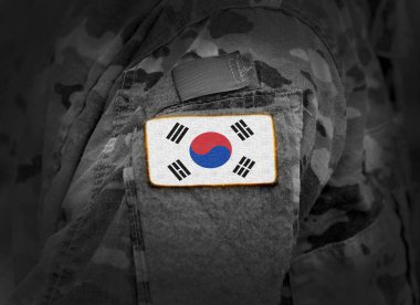 South Korea flag on soldiers arm (collage). clipart