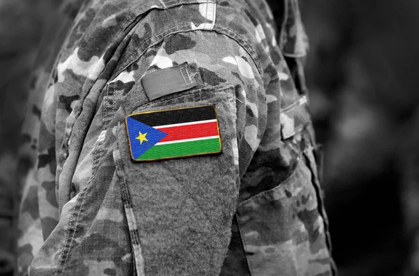 Flag of South Sudan on soldiers arm. South Sudan flag on military uniform. Army, troops, Africa (collage).