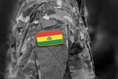 Flag of Bolivia on soldiers arm. Flag of Bolivia on military uniforms (collage). clipart