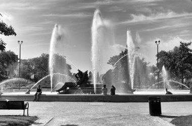 Philadelphia, USA - May 29, 2018: People seated near the Swann Memorial Fountain in center of Philadelphia, PA, USA  clipart