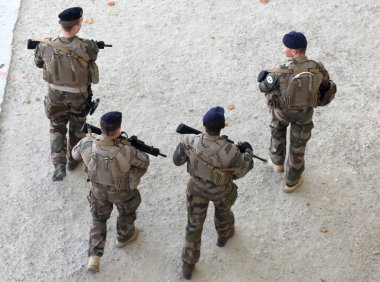  A military patrol in the center of  Paris. clipart