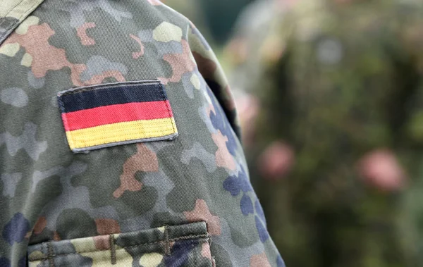 Flag of Germany on soldiers arm. Germany military uniform.