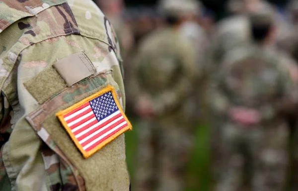 American Soldiers and Flag of USA on soldiers arm. US Army.