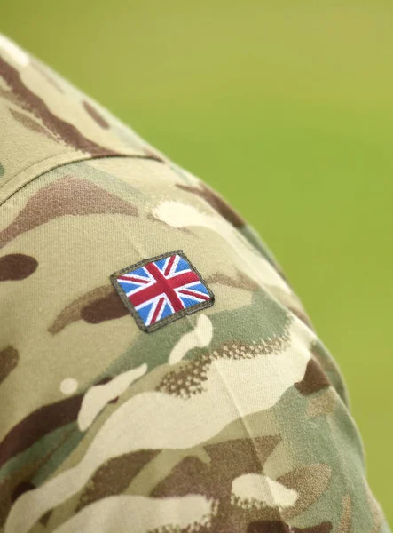 UK flag on soldiers arm. UK military uniform.