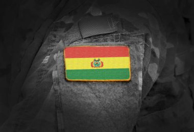 Flag of Bolivia on soldiers arm. Flag of Bolivia on military uniforms (collage). clipart