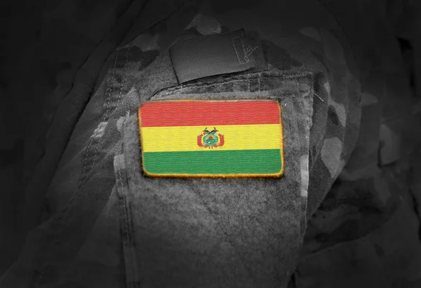 Flag of Bolivia on soldiers arm. Flag of Bolivia on military uniforms (collage). — Stock Photo, Image