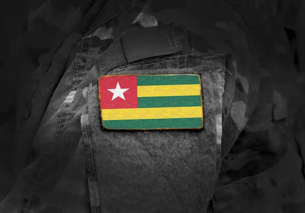 Flag of Togo on military uniform. — Stock Photo, Image